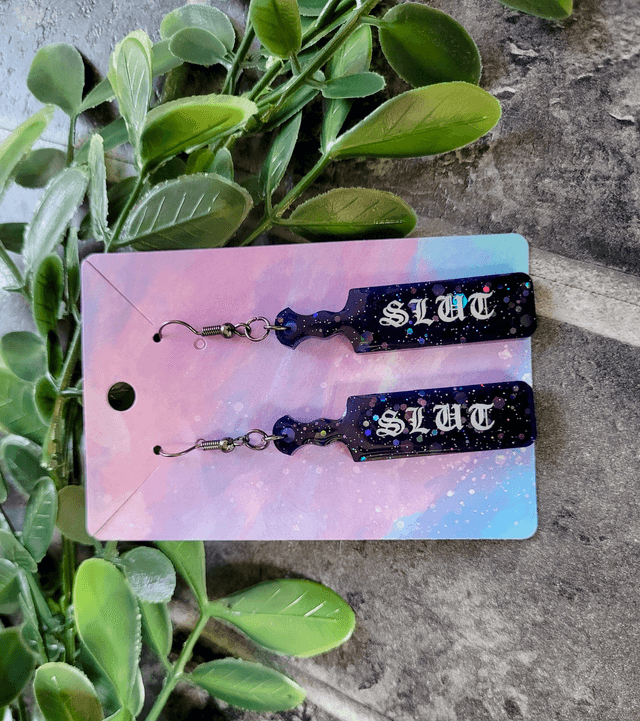 Earrings | Slut Mini Paddle Earrings – Black-Blue Glitter - Old English Font | Stainless Steel Hooks