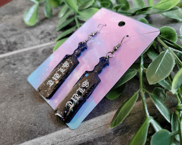 Earrings | Slut Mini Paddle Earrings – Black-Blue Glitter - Old English Font | Stainless Steel Hooks