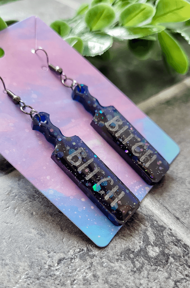 Earrings | Blue-Black Holographic Glitter BITCH earrings  | Stainless Steel Gunmetal Black Hooks