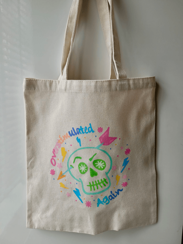 Pastel Hand-Painted “Overstimulated Again” Tote Bag