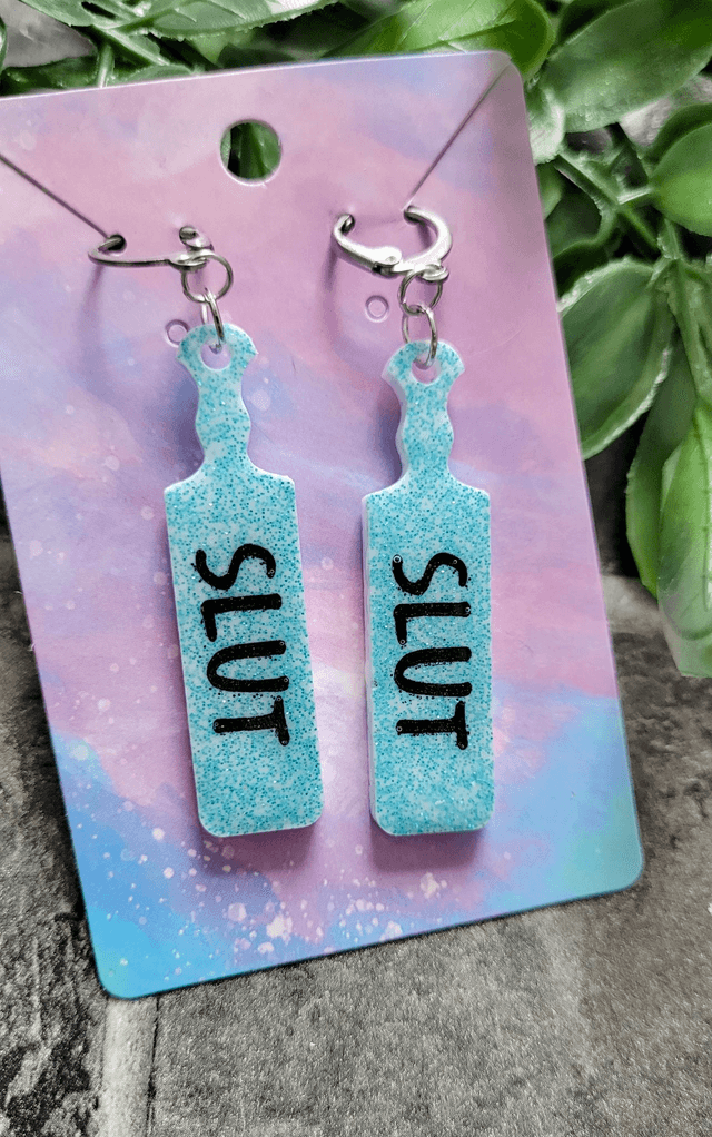 Earrings | SLUT Paddle Earrings Light Blue Glitter on White Base | Stainless Steel Hoops