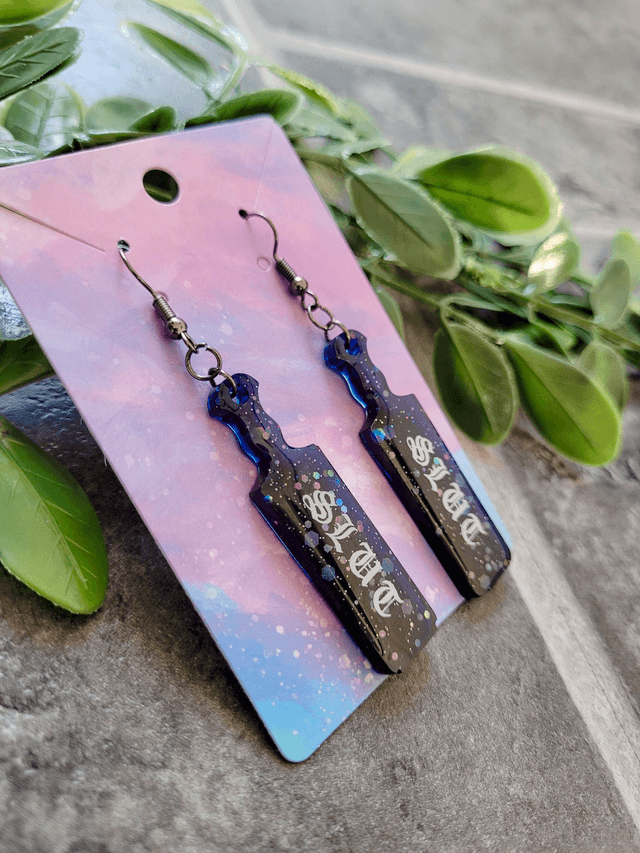 Earrings | Slut Mini Paddle Earrings – Black-Blue Glitter - Old English Font | Stainless Steel Hooks